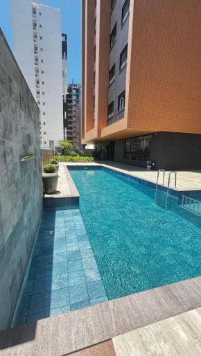 Ap. com piscina e academia na praia grande